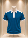 Polo bleu pétrole et blanc à col zippé